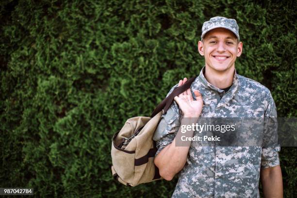 portrait of brave young soldier - man in military uniform stock pictures, royalty-free photos & images