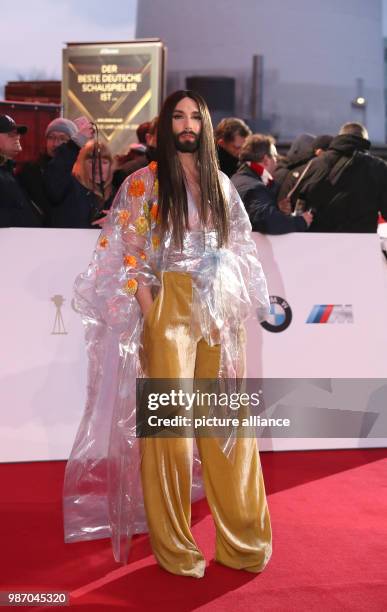 February 2018, Germany, Hamburg, Golden Camera Awards Ceremony: Austrian singer Conchita Wurst arrives on the red carpet. Photo: Christian...