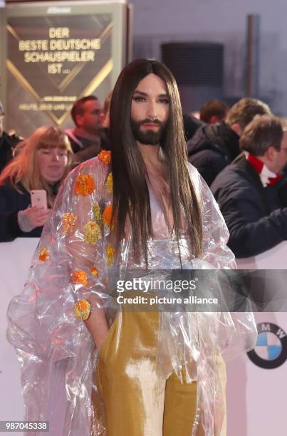 February 2018, Germany, Hamburg, Golden Camera Awards Ceremony: Austrian singer Conchita Wurst arrives on the red carpet. Photo: Christian...