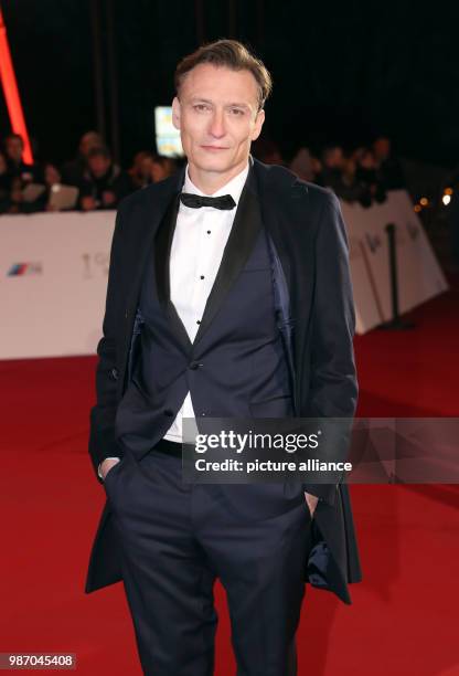 February 2018, Germany, Hamburg, Golden Camera Awards Ceremony: Actor Oliver Masucci arrives for the award ceremony - he is nominated in the category...