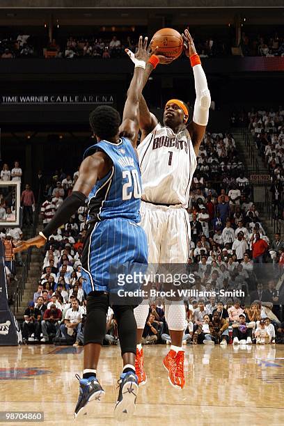 Stephen Jackson of the Charlotte Bobcats shoots a jump shot against Mickael Pietrus of the Orlando Magic in Game Three of the Eastern Conference...