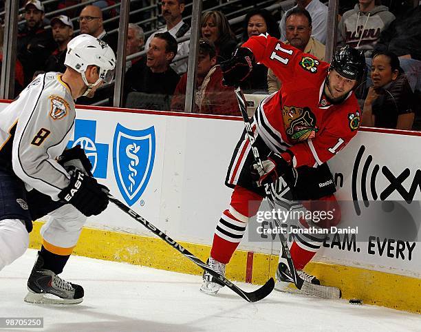 John Madden of the Chicago Blackhawks looks to pass under pressure from Kevin Klein of the Nashville Predators in Game Five of the Western Conference...