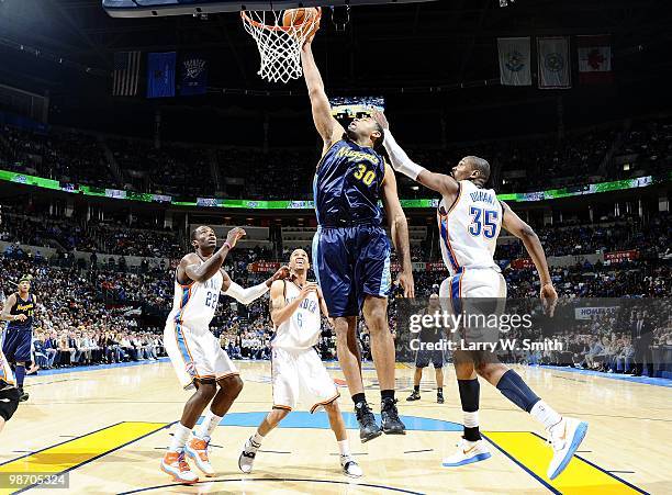 Malik Allen of the Denver Nuggets goes up for the dunk against the Oklahoma City Thunder during the game at Ford Center on April 7, 2010 in Oklahoma...