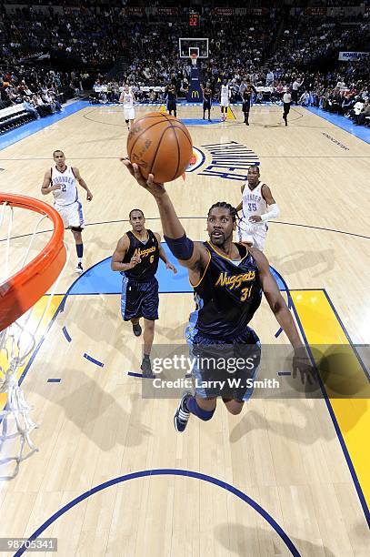 Nene of the Denver Nuggets lays up a shot against the Oklahoma City Thunder during the game at Ford Center on April 7, 2010 in Oklahoma City,...