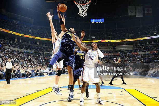 Nene of the Denver Nuggets goes up for the layup against the Oklahoma City Thunder during the game at Ford Center on April 7, 2010 in Oklahoma City,...
