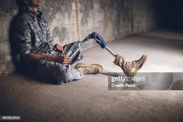 young depressed soldier with amputee leg - injured us army stock pictures, royalty-free photos & images