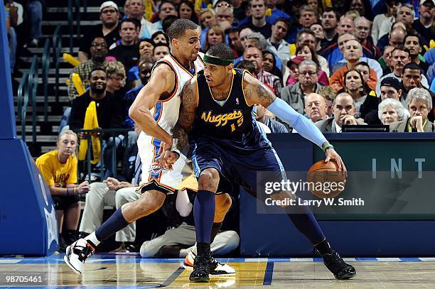 Carmelo Anthony of the Denver Nuggets posts up against Thabo Sefolosha of the Oklahoma City Thunder during the game at Ford Center on April 7, 2010...