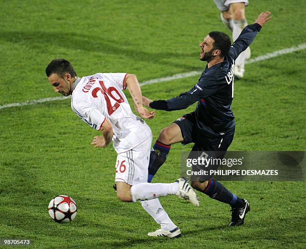 Lyon's Argentinian forward Lisandro Lopez fights for the ball with Munich's German defender Diego Contento during the second leg of the UEFA...