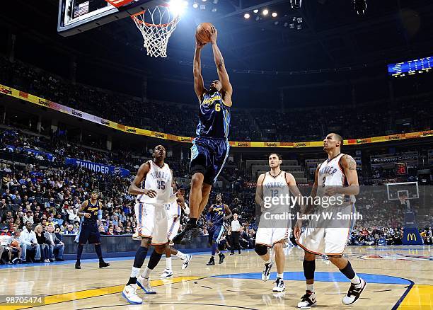 Arron Afflalo of the Denver Nuggets goes up for the slam dunk against the Oklahoma City Thunder during the game at Ford Center on April 7, 2010 in...