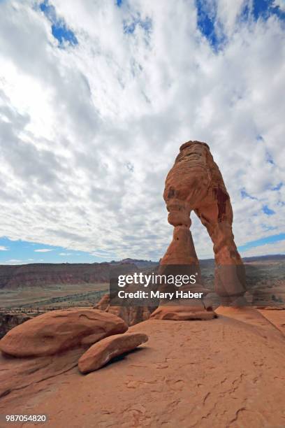 delicate arch and clouds - mary moody stock-fotos und bilder