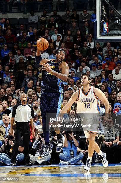 Nene of the Denver Nuggets looks to make a pass play against the Oklahoma City Thunder during the game at Ford Center on April 7, 2010 in Oklahoma...