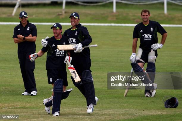 England captain Paul Collingwood celebrates winning a six competition with Graham Swann during an England training session at the 3Ws Ground Cave...