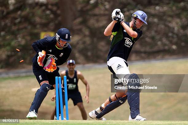 Stuart Broad is bowled as Craig Kieswetter looks on during an England training session at the 3Ws Ground Cave Hill Campus on April 27, 2010 in...