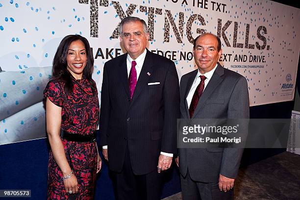 Stacy Sharpe of Allstate, Secretary of Transportation Ray LaHood and Bill Vainisi of Allstate pose for a photo at the Allstate 'X the TXT' press...