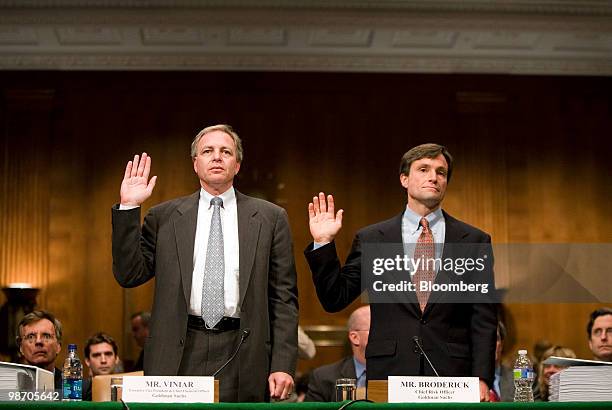 David Viniar, executive vice president and chief financial officer of Goldman Sachs Group Inc., left, and Craig Broderick, chief risk officer of...