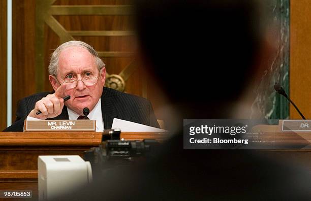 Senator Carl Levin, left, a Democrat from Michigan, questions witnesses at a Senate Homeland Security and Governmental Affairs subcommittee hearing...