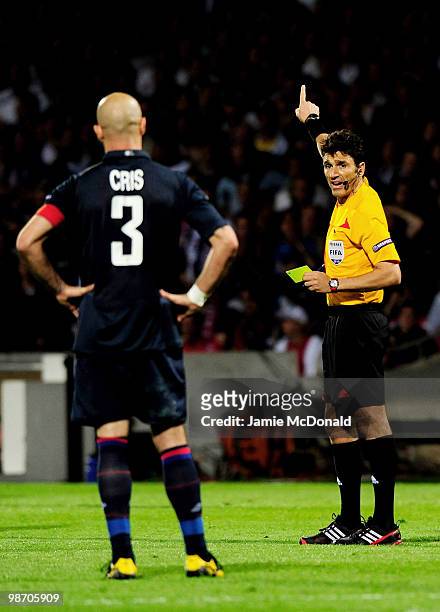 Cris of Olympique Lyonnais is sent off for receiving a second yellow card by Referee Massimo Busacca of Switzerland after his tackle on Ivica Olic of...