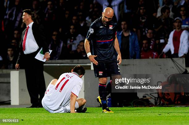 Cris of Olympique Lyonnais shouts at Ivica Olic of Bayern Muenchen after being sent off for receiving a second yellow card for fouling him during the...