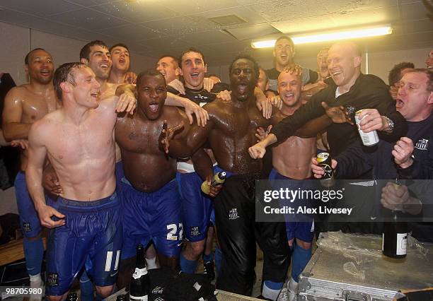 The Notts County players celebrate in their dressing room after winning the Coca Cola League Two title after the Coca Cola League Two match between...