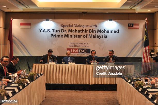 The Malaysian Prime Minister Mahathir Mohamad on a press conference with Indonesia-Malaysia Business Council Chairman Tanri Abeng at Grand Hyatt in...