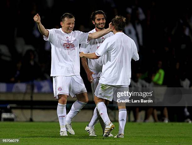 Hatrick goalscorer Ivica Olic of Bayern Muenchen celebrates with teammates after reaching the final following their team's 3-0 victory of the UEFA...