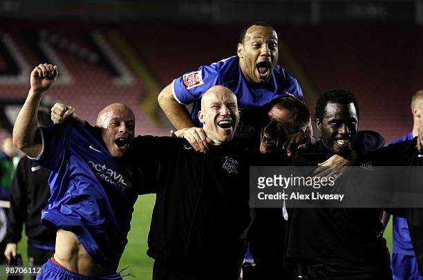 Luke Rodgers, Lee Hughes and Ade Akinbiyi of Notts County celebrate after winning the Coca Cola League Two title after the Coca Cola League Two match...
