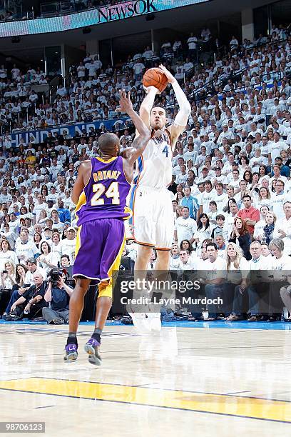 Nick Collison of the Oklahoma City Thunder shoots over Kobe Bryant of the Los Angeles Lakers in Game Four of the Western Conference Quarterfinals...