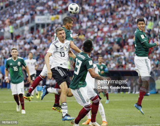 Thomas Mueller of Germany competes for a header during the second half of Germany's 1-0 loss to Mexico in a World Cup Group F match at Luzhniki...