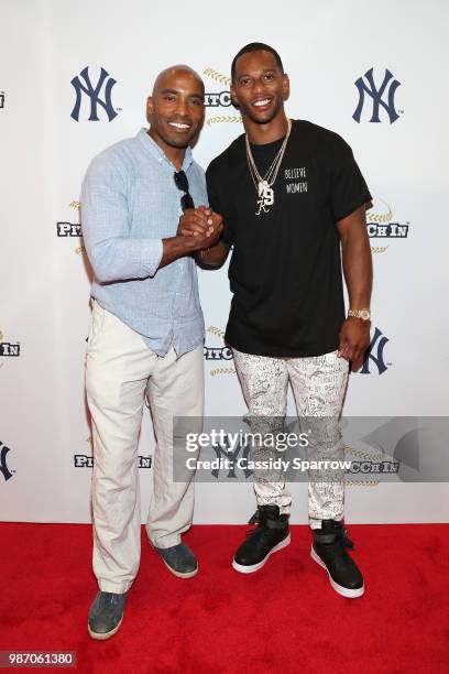 Tiki Barber and Victor Cruz attend CC Sabathia's PitCChIn Foundation Celebrity Softball Game at Yankee Stadium on June 28, 2018 in New York City.