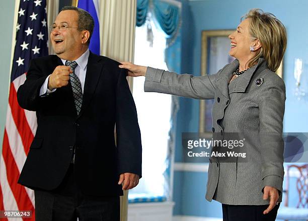 Secretary of State Hillary Clinton and Israeli Defense Minister Ehud Barak share a moment as they speak to the media after a meeting at the State...