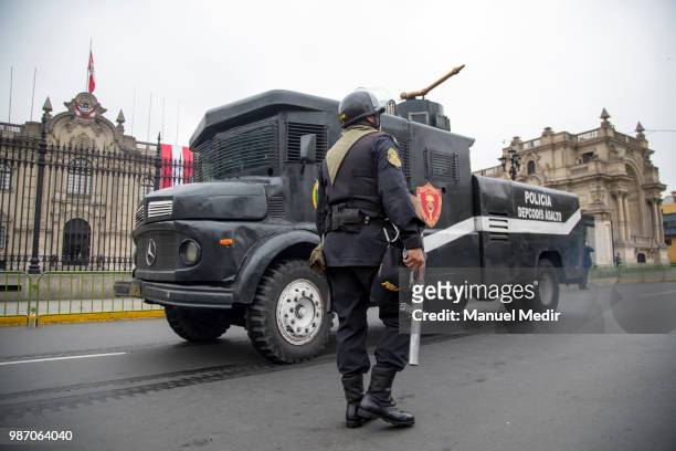 Riot police is seen during a protest against corruption in public institutions in front of Government Palace on June 27, 2018 in Lima, Peru.