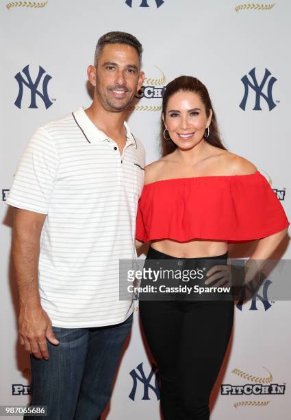 Jorge Posada and Laura Posada attend CC Sabathia's PitCChIn Foundation Celebrity Softball Game at Yankee Stadium on June 28, 2018 in New York City.