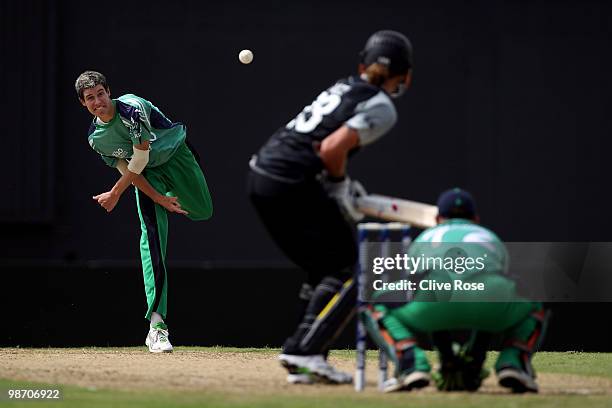 George Dockrell of Ireland bowls during The ICC T20 World Cup warm up match between Ireland and New Zealand at The Guyana National Stadium Cricket...