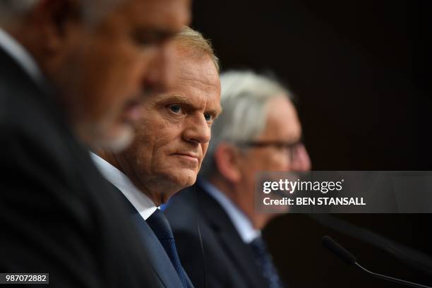 European Council President Donald Tusk looks on as he gives a joint press conference with President of the European Commission Jean-Claude Juncker...