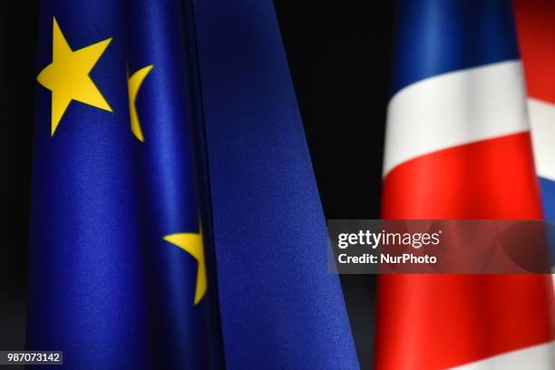 European and a Union Flag are pictured at The European Council summit in Brussels on June 28, 2018. European Union leaders meet today for the two-day...