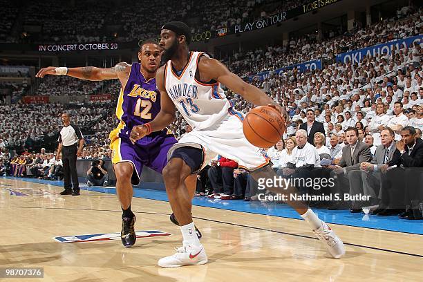 James Harden of the Oklahoma City Thunder drives to the basket past Shannon Brown of the Los Angeles Lakers in Game Four of the Western Conference...