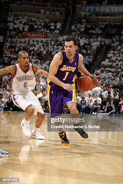 Jordan Farmar of the Los Angeles Lakers drives past Eric Maynor of the Oklahoma City Thunder in Game Four of the Western Conference Quarterfinals...