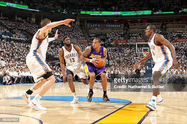 Shannon Brown of the Los Angeles Lakers goes up against Nick Collison, James Harden and Serge Ibaka of the Oklahoma City Thunder in Game Four of the...
