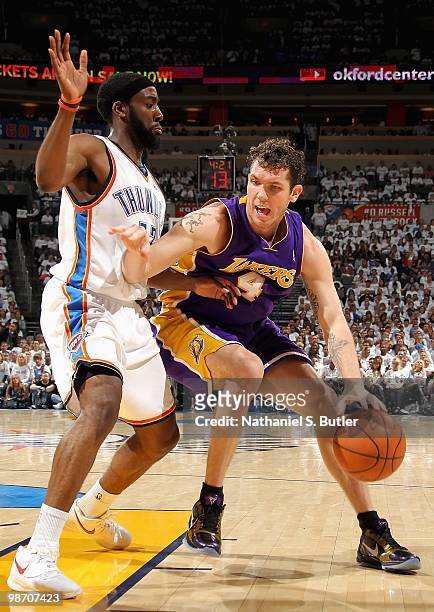 Luke Walton of the Los Angeles Lakers goes up against James Harden of the Oklahoma City Thunder in Game Four of the Western Conference Quarterfinals...