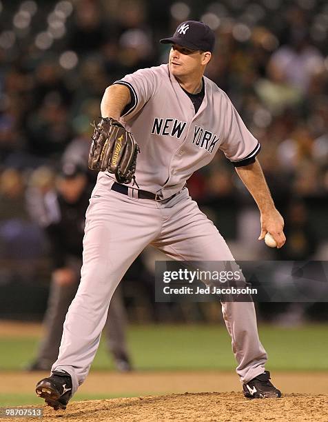 Javier Vazquez of the New York Yankees pitches against the Oakland Athletics during an MLB game at the Oakland-Alameda County Coliseum on April 20,...