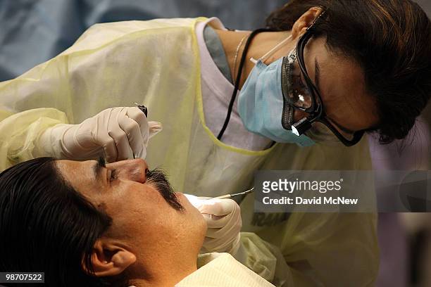 Dental care is performed at the Remote Area Medical clinic at the Los Angeles Sports Arena on April 27, 2010 in Los Angeles, California. More than...
