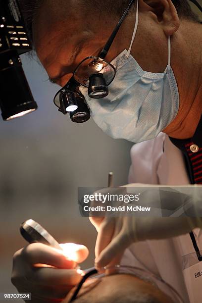 Dental care is performed at the Remote Area Medical clinic at the Los Angeles Sports Arena on April 27, 2010 in Los Angeles, California. More than...
