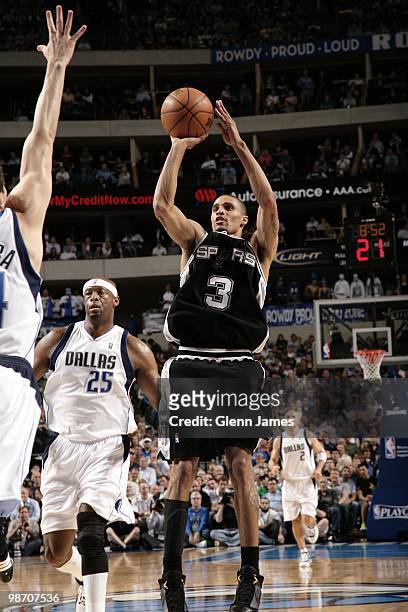 George Hill of the San Antonio Spurs shoots a jump shot against Erick Dampier of the Dallas Mavericks in Game Two of the Western Conference...