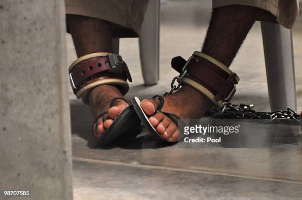 Guantanamo detainee's feet are shackled to the floor as he attends a "Life Skills" class inside the Camp 6 high-security detention facility April 27,...