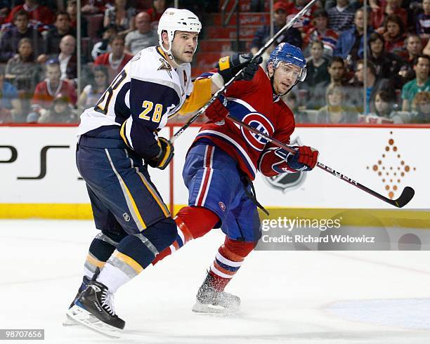 Paul Gaustad of the Buffalo Sabres and Josh Gorges of the Montreal Canadiens collide during the NHL game on April 3, 2010 at the Bell Centre in...