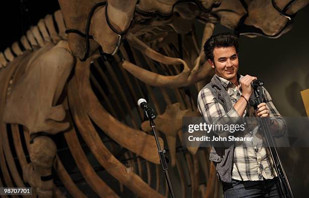 Musician Kevin Jonas of the Jonas Brothers speaks to students from Manhattan Place Elementary School at the Natural History Museum on April 27, 2010...