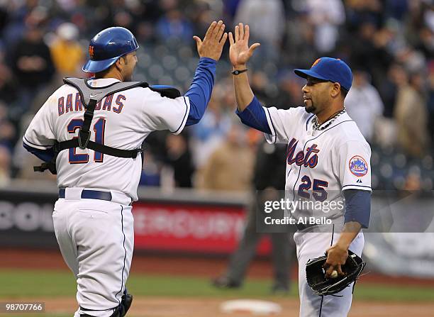 Pedro Feliciano and Rod Barajas of the New York Mets celebrate a 4-0 win against the Los Angeles Dodgers on April 27, 2010 at Citi Field in the...