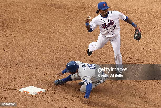 Jose Reyes of the New York Mets attempts a double play as Rafael Furcal of the Los Angeles Dodgers slides during their game on April 27, 2010 at Citi...