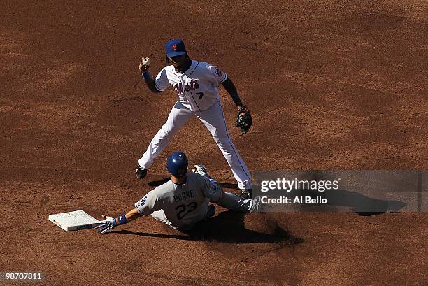 Jose Reyes of the New York Mets attempts a double play as Casey Blake of the Los Angeles Dodgers slides during their game on April 27, 2010 at Citi...
