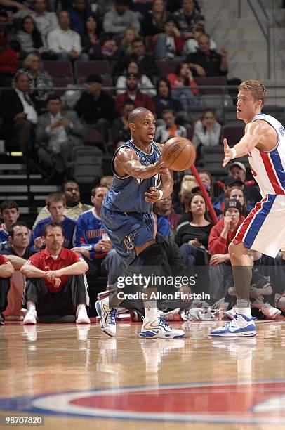 Randy Foye of the Washington Wizards passes around Jonas Jerebko of the Detroit Pistons during the game on March 12, 2010 at The Palace of Auburn...